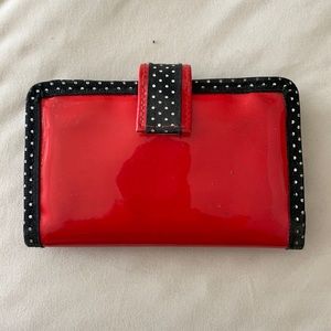 Glossy red wallet with black/white polka dot trim